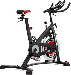 Schwinn Fitness 700IC Vélo de Cycling Indoor – Vélo d’Appartement Silencieux avec Volant 18 kg, Résistance Infinie, Console LCD, Pédales SPD, Sans Abonnement