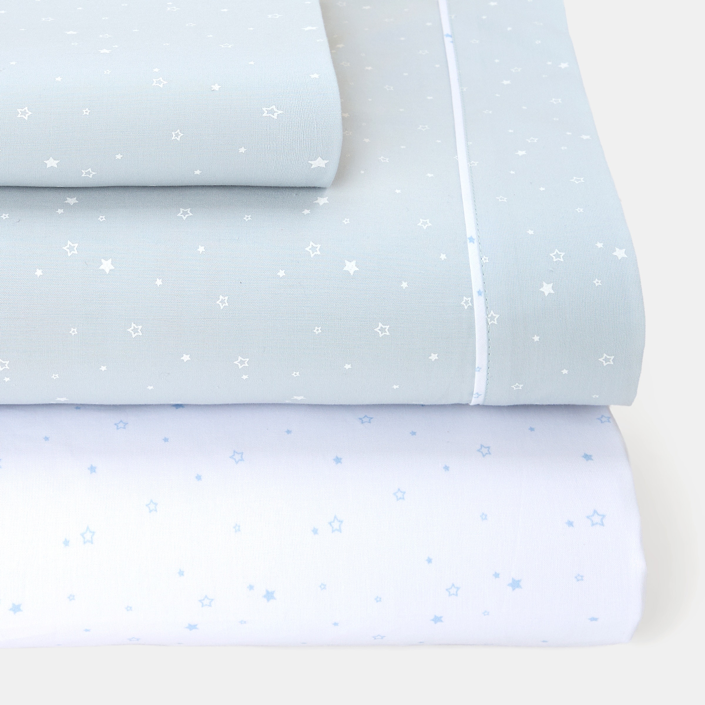Cotton Juice Baby Home - Juego de sábanas Cotton Juice Baby Home Básico 3 piezas estrellas fondo color (disponible en varias tallas). - Image 1